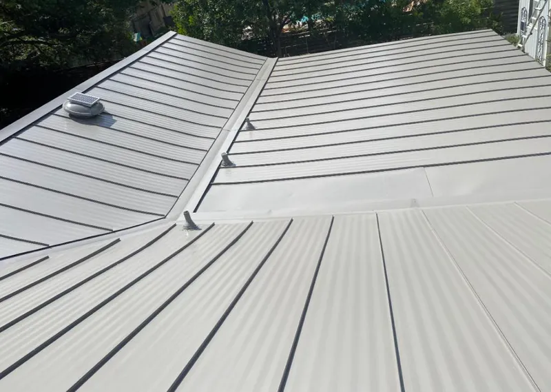 Solar attic fan installed on a metal roof for Roof Ventilation in Hollister
